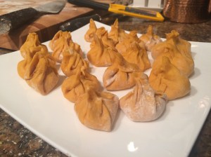 Pumpkin Sacchetti Pasta with crumbled sausage and a bechamel sauce with crumbled amaretti