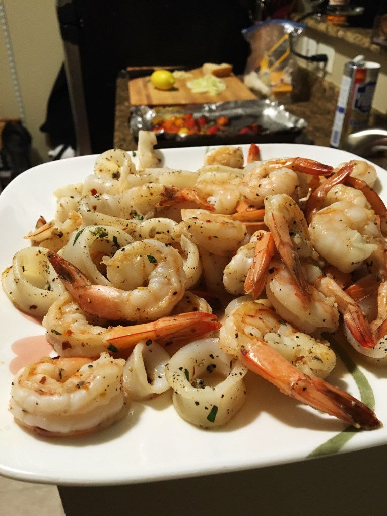 Calamari and shrimp in roasted baby heirloom caper fennel white wine sauce