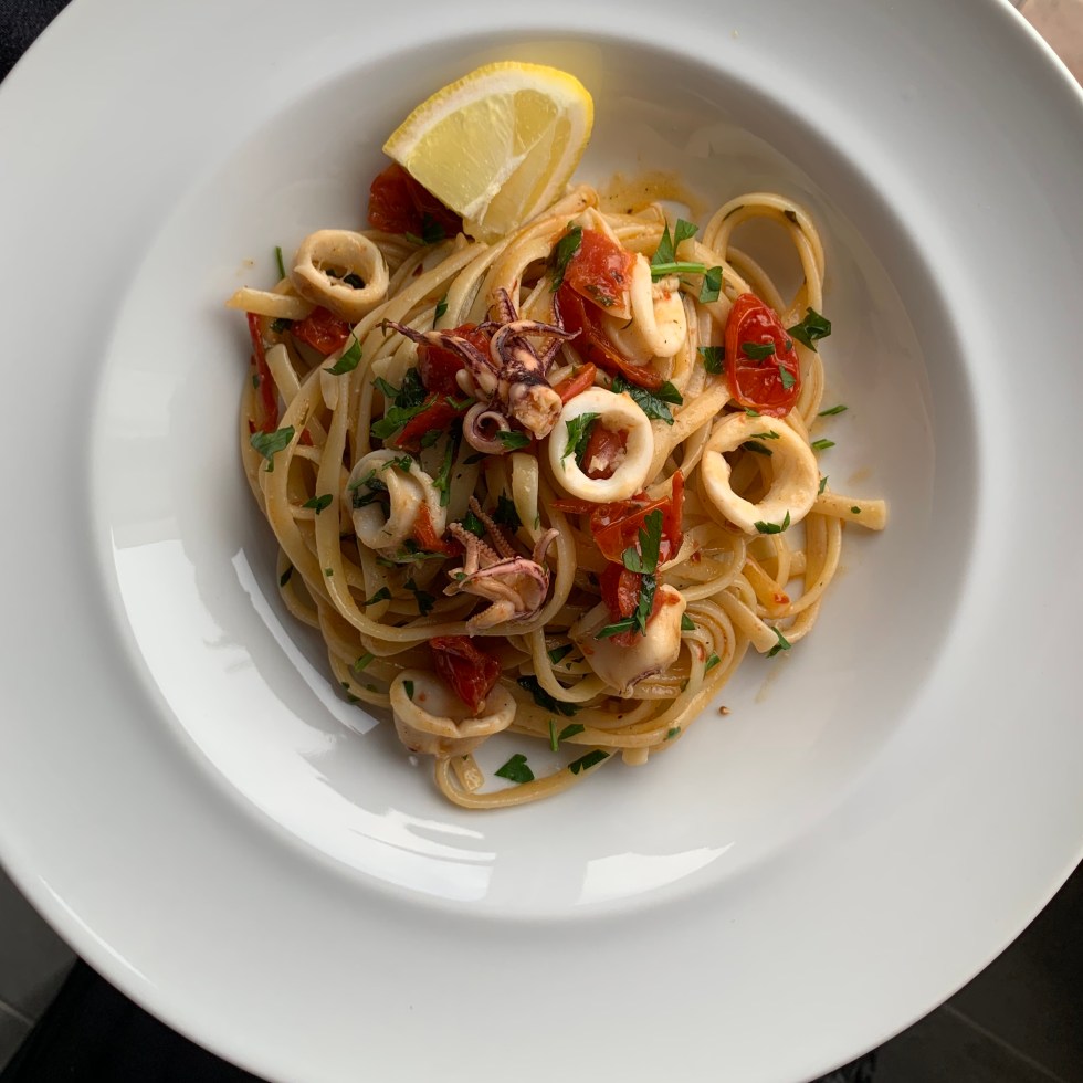 Linguine, calamari, lemon, tomatoes and white wine