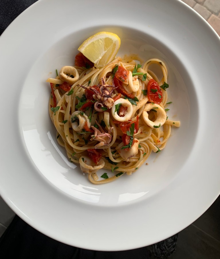 Linguine, calamari, lemon, tomatoes and white wine